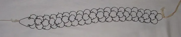 A cilice — a spiked chain used for corporal mortification
