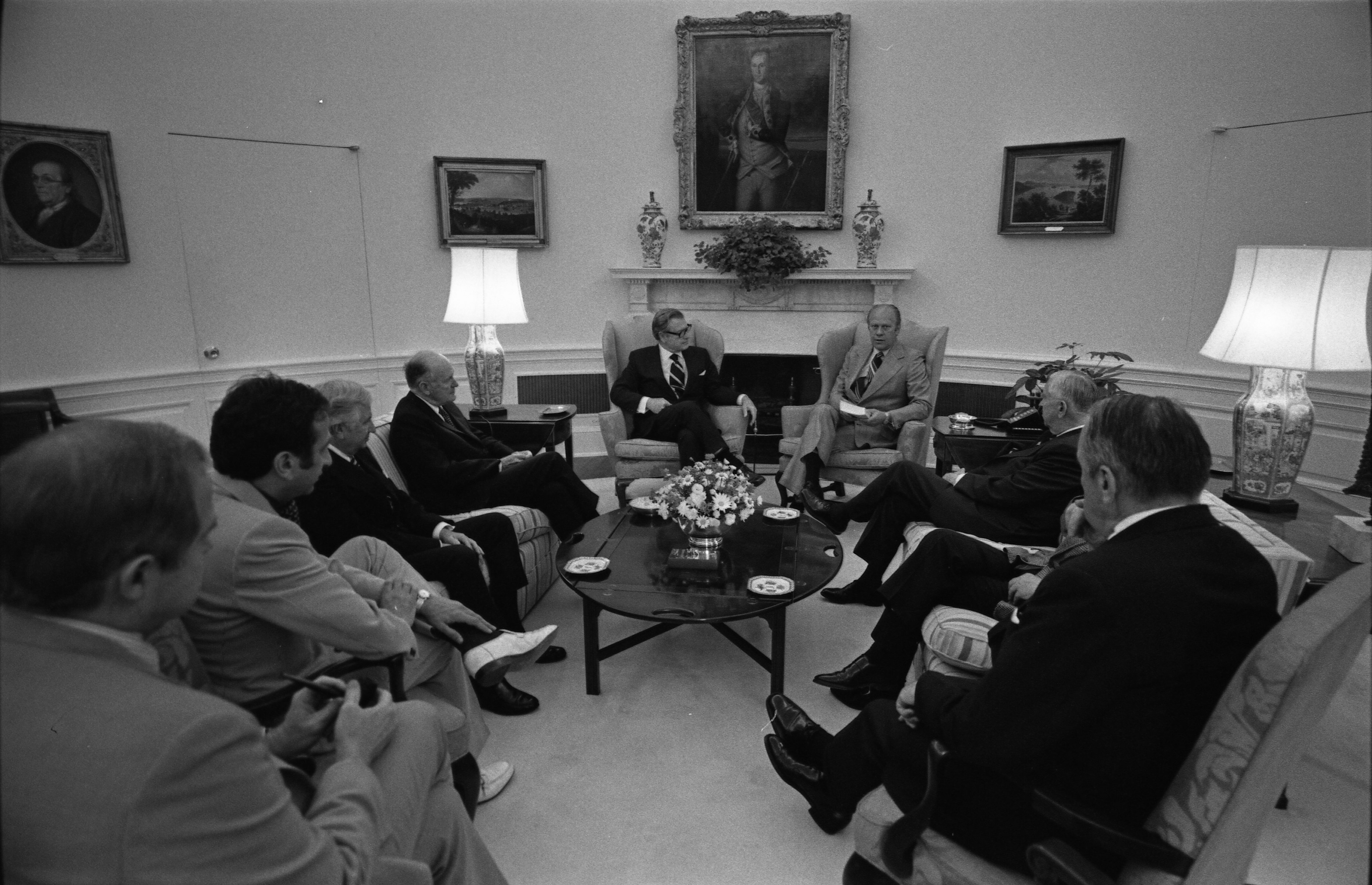 President Ford receiving the Rockefeller Commission report on CIA activities, 1975
