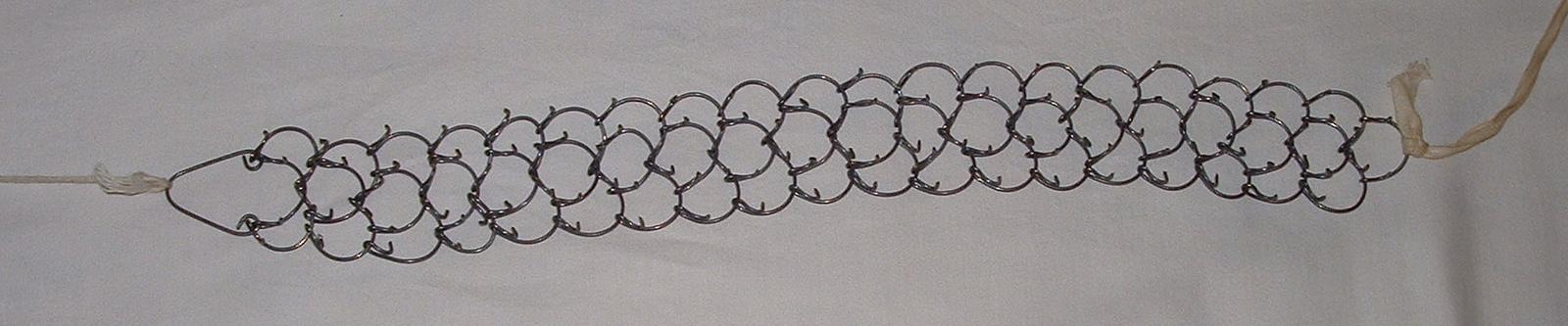 A cilice — a spiked chain used for corporal mortification