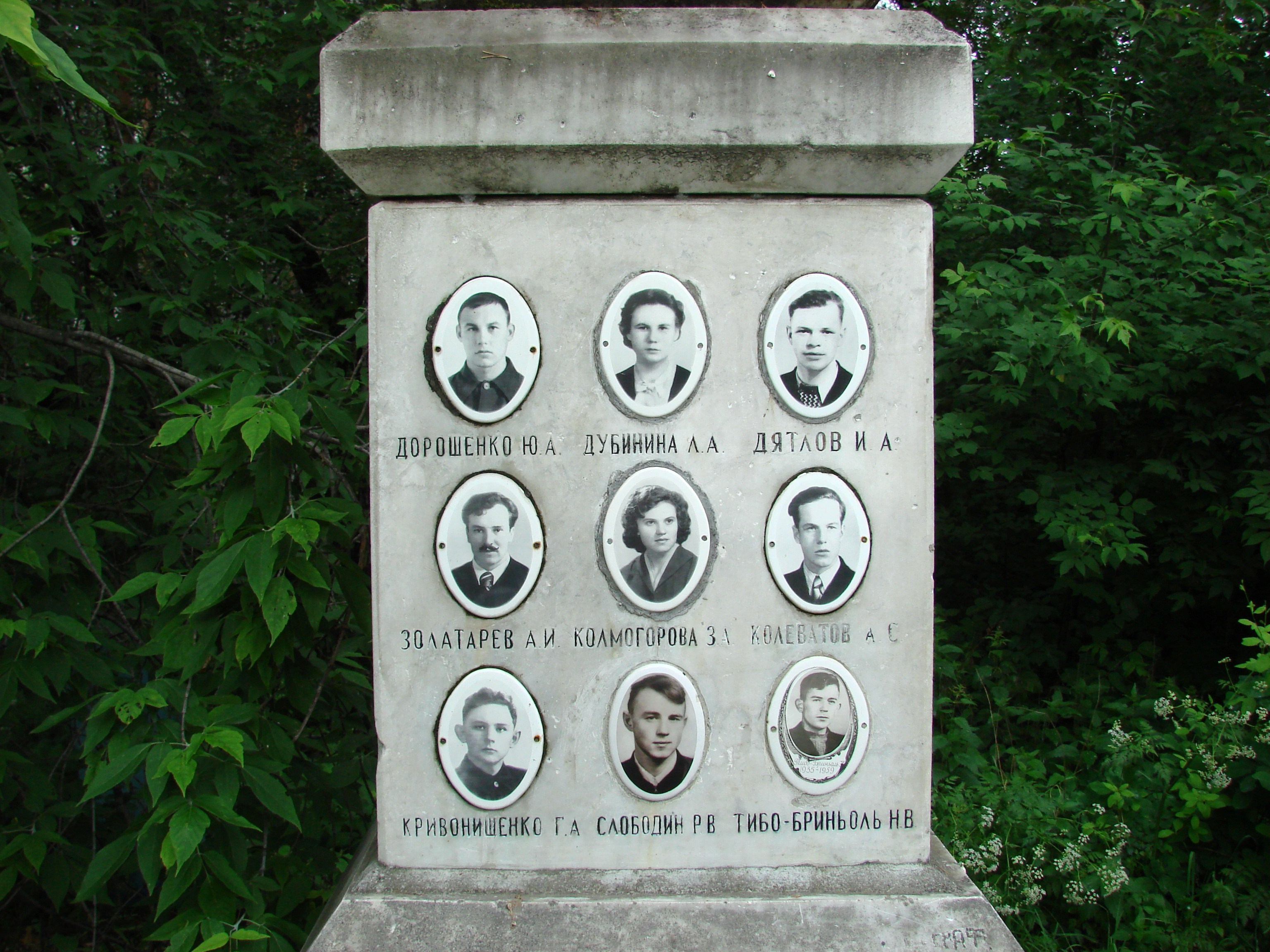 Memorial with portraits of the nine Dyatlov group members