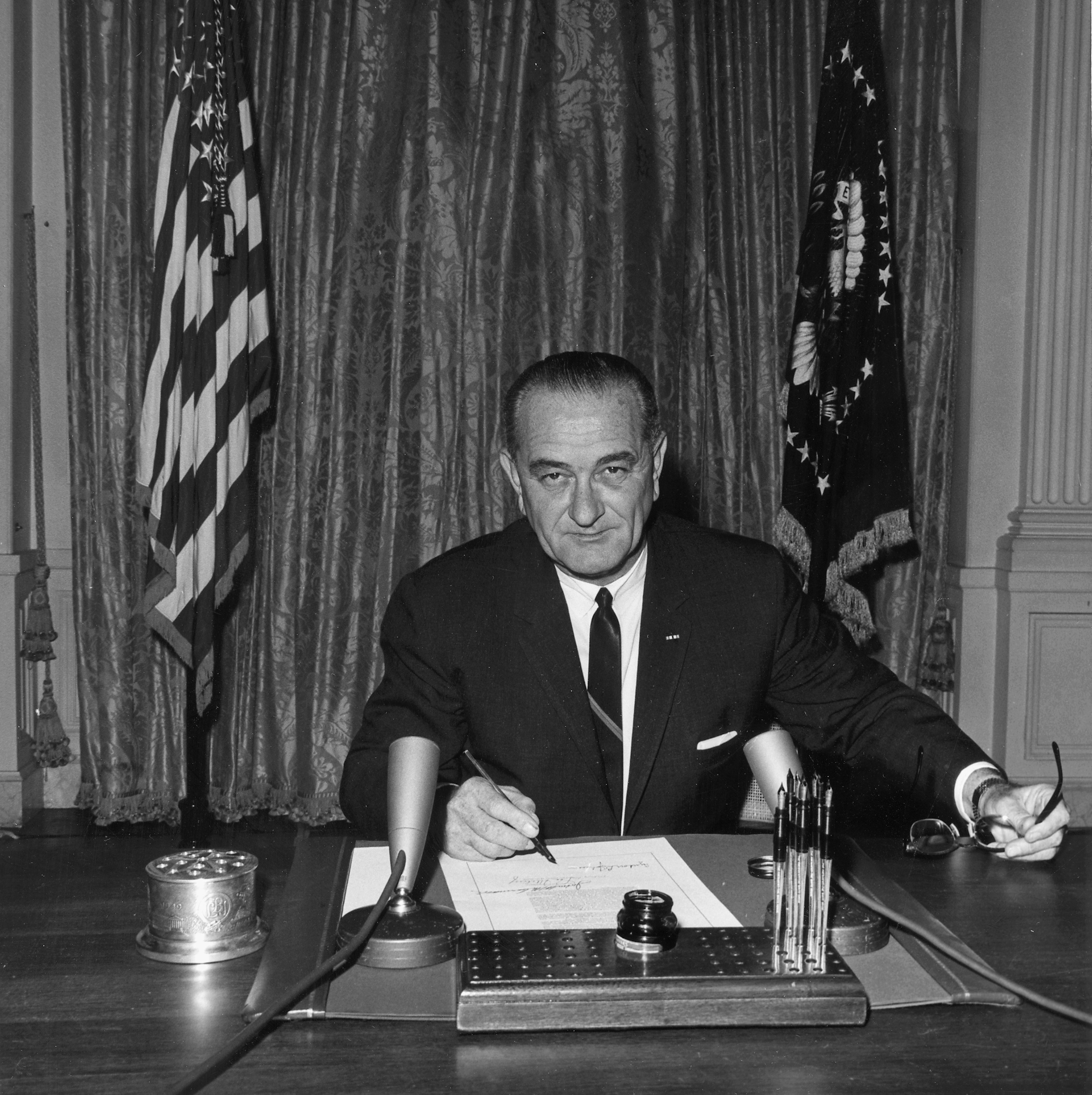 President Johnson signs the Gulf of Tonkin Resolution